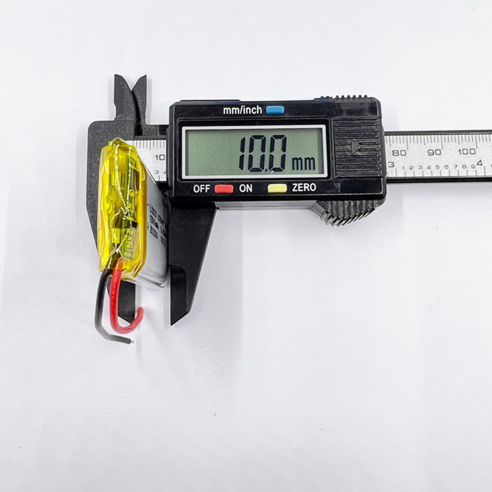 103048 battery thickness measurement, caliper showing 10mm, verifying size compatibility with portable electronics