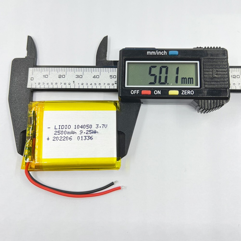 104050 battery length measurement, caliper showing 50mm, for speaker hand warmer power bank battery size confirmation