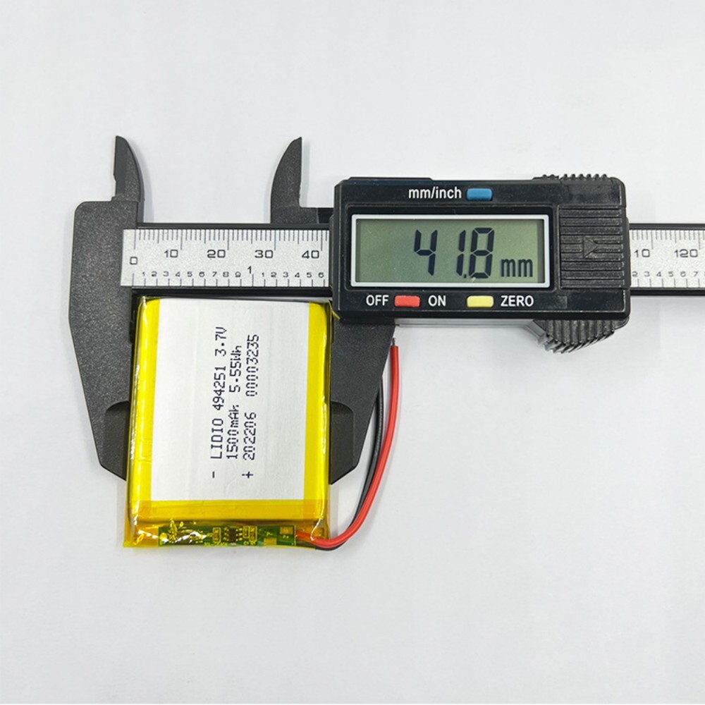494251 battery width measurement, caliper showing 42mm, ensuring proper fit for device battery compartment